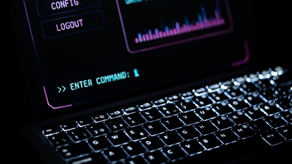 Close-up of a glowing laptop keypad with digital interface, representing futuristic technology.